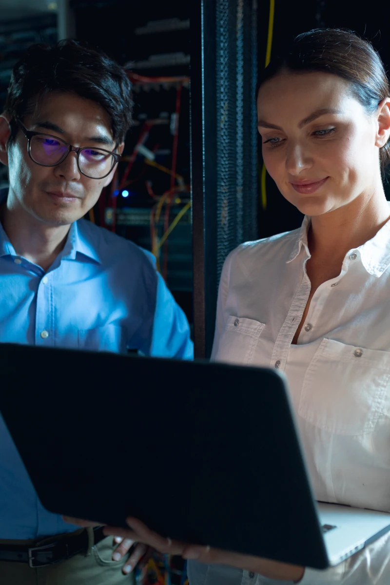 IT Consultant holding network equipment in Datacenter