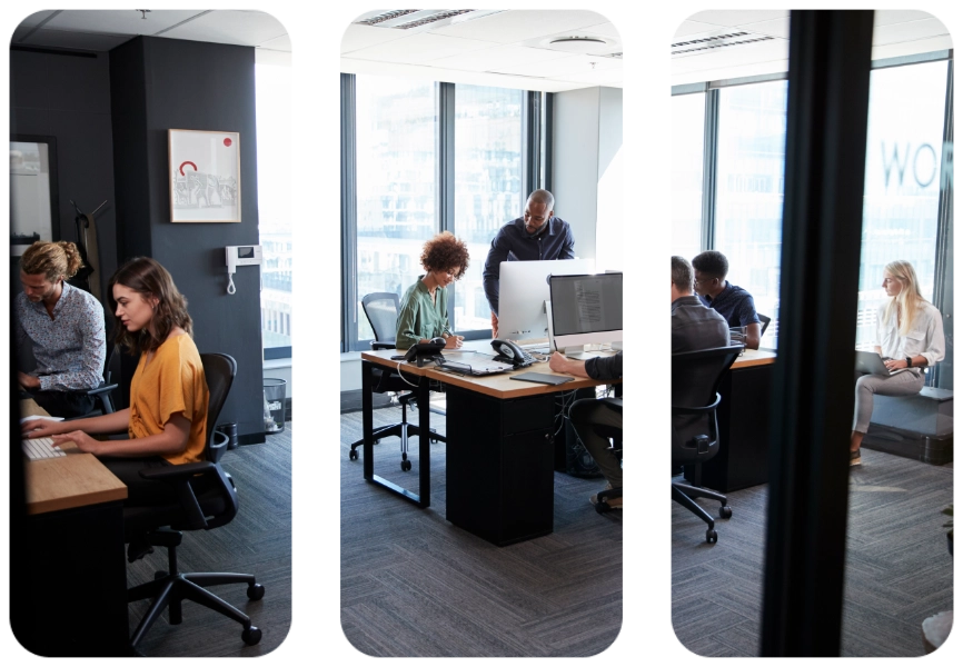 Young creative team working together at computers in a casual office, seen from doorway
